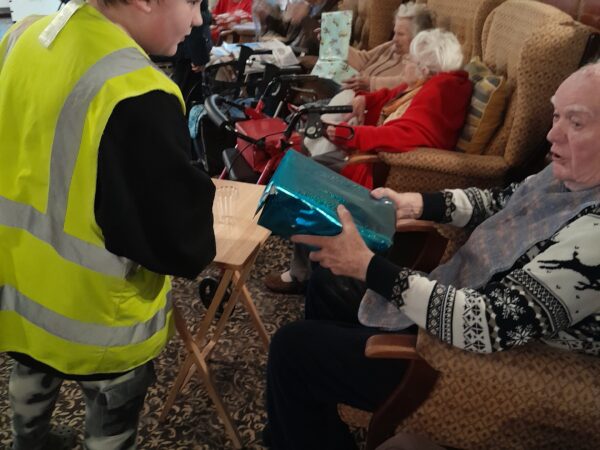 Residents at a local residential care home enjoy spending time with learners from Highgate Hill House School.