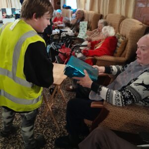 Residents at a local residential care home enjoy spending time with learners from Highgate Hill House School.